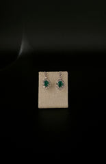 Orecchini brillanti e smeraldi.